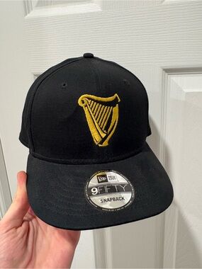 Guinness Beer New Era Black Snapback Hat with Gold Harp Logo